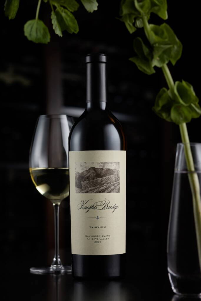 Fairview Sauvignon Blanc in dark light with greenery.